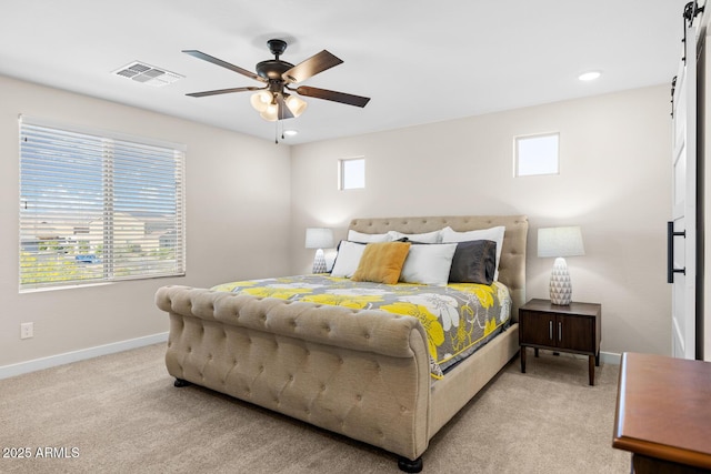 bedroom with visible vents, multiple windows, light carpet, and baseboards