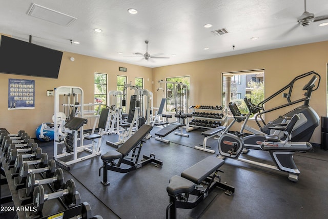 gym featuring recessed lighting, a ceiling fan, and visible vents