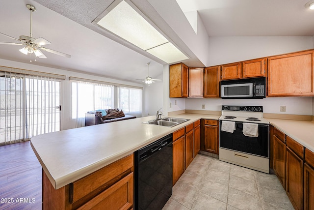 812 E Piute Ave, Phoenix, AZ 85024 - kitchen with range with electric cooktop, black dishwasher, a sink, vaulted ceiling, and ceiling fan