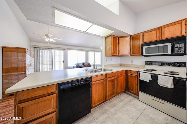 812 E Piute Ave, Phoenix, AZ 85024 - kitchen featuring black appliances, a sink, lofted ceiling, a peninsula, and brown cabinetry