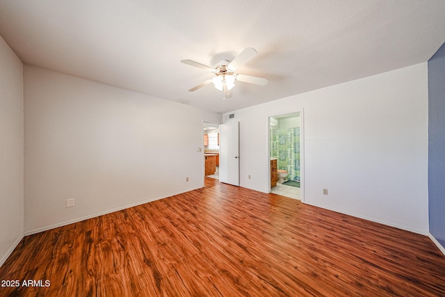 812 E Piute Ave, Phoenix, AZ 85024 - empty room featuring wood finished floors, ceiling fan, and baseboards