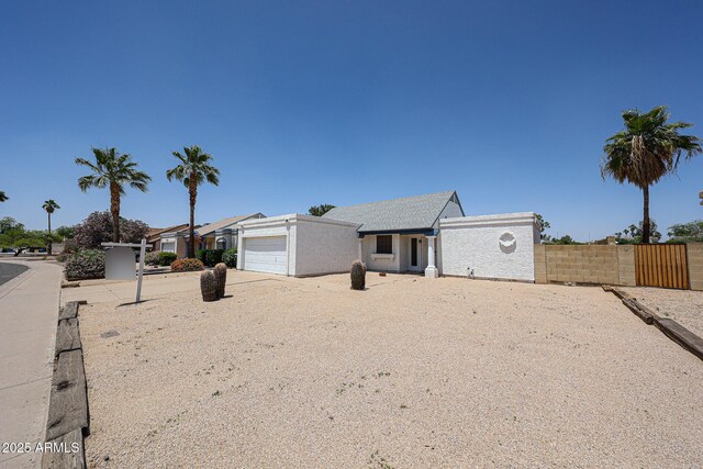 812 E Piute Ave, Phoenix, AZ 85024 - view of front of property with a garage, fence, and concrete driveway