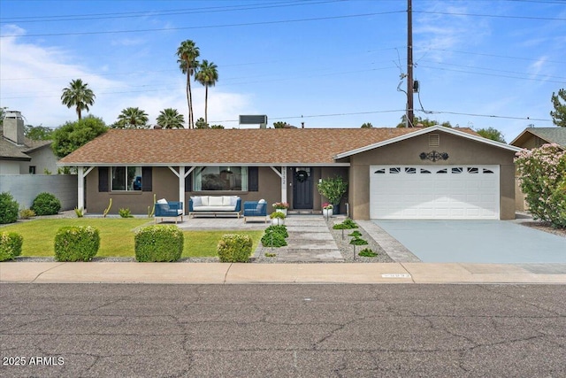 5332 N 81st Pl, Scottsdale, AZ 85250 - single story home featuring outdoor lounge area, stucco siding, concrete driveway, and an attached garage