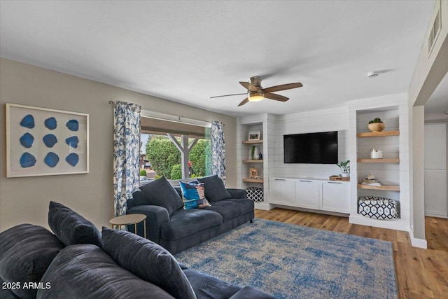 5332 N 81st Pl, Scottsdale, AZ 85250 - living area with a ceiling fan and light wood-style flooring