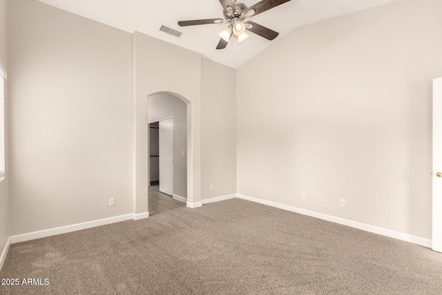 10317 E Kiva Cir, Mesa, AZ 85209 - empty room featuring visible vents, arched walkways, a ceiling fan, carpet flooring, and lofted ceiling