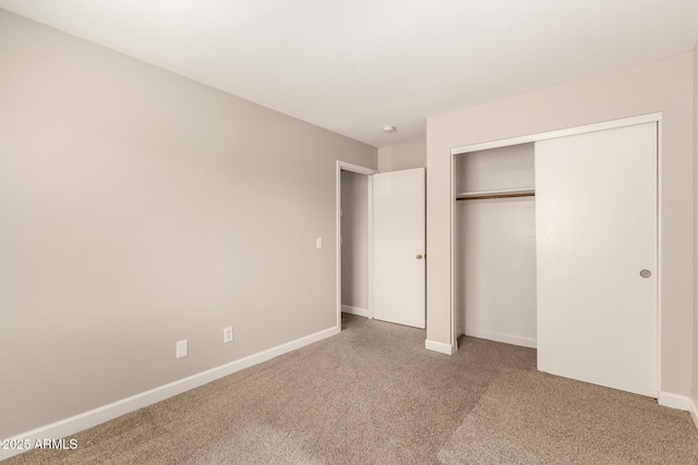 10317 E Kiva Cir, Mesa, AZ 85209 - unfurnished bedroom with a closet, baseboards, and carpet floors