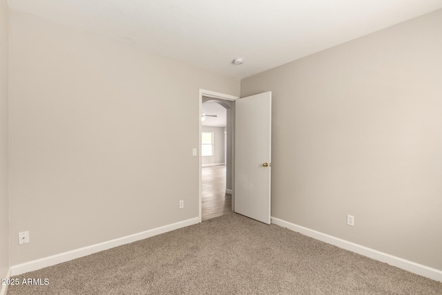 10317 E Kiva Cir, Mesa, AZ 85209 - spare room featuring light colored carpet and baseboards