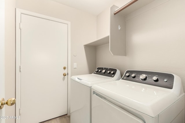 10317 E Kiva Cir, Mesa, AZ 85209 - laundry area with light wood finished floors, washing machine and dryer, and laundry area