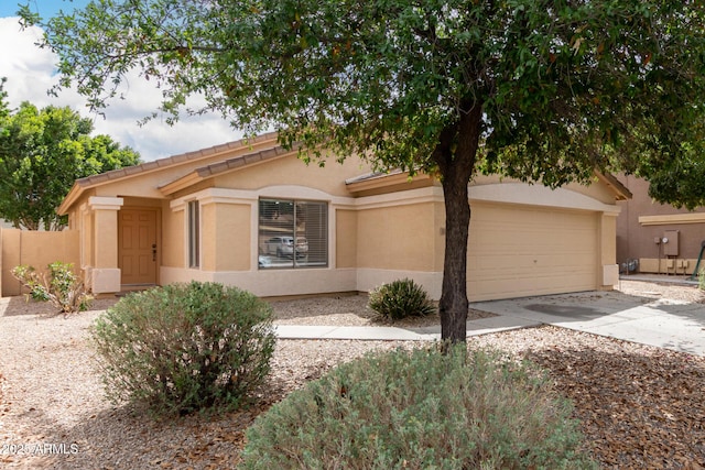 10317 E Kiva Cir, Mesa, AZ 85209 - view of front of house featuring concrete driveway, an attached garage, and stucco siding