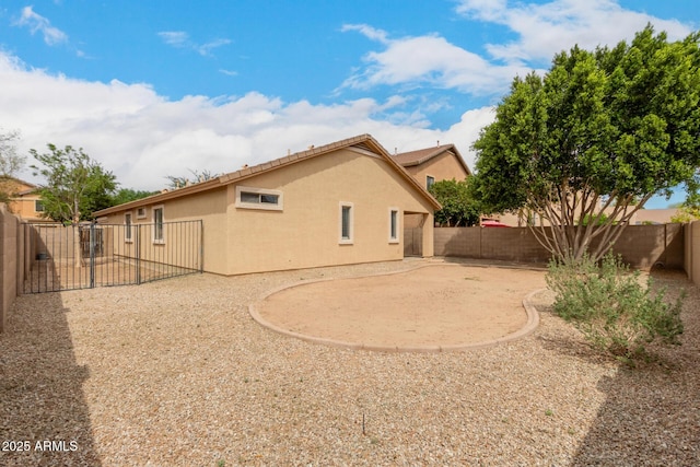10317 E Kiva Cir, Mesa, AZ 85209 - rear view of house featuring a patio, a fenced backyard, and stucco siding