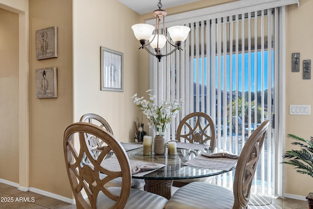 tiled dining space with a notable chandelier