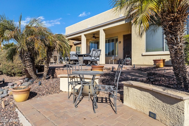 view of patio with ceiling fan