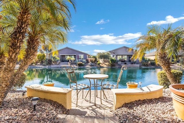 view of pool with a water view