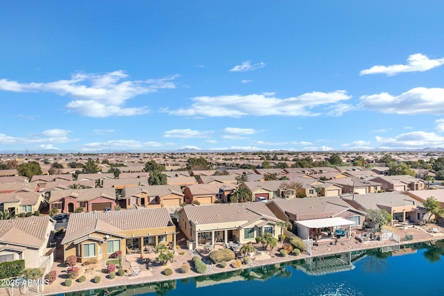 bird's eye view featuring a residential view and a water view