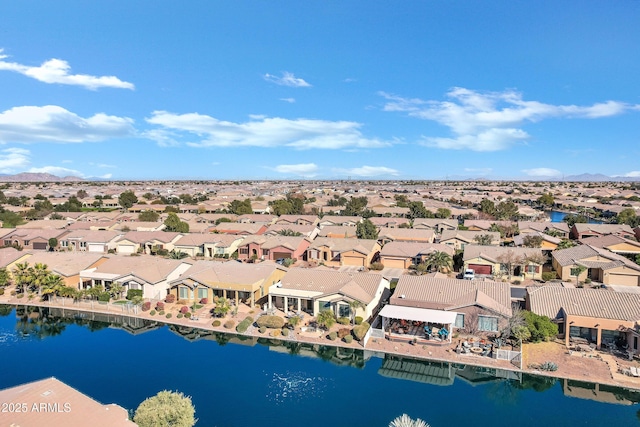 birds eye view of property featuring a water view and a residential view