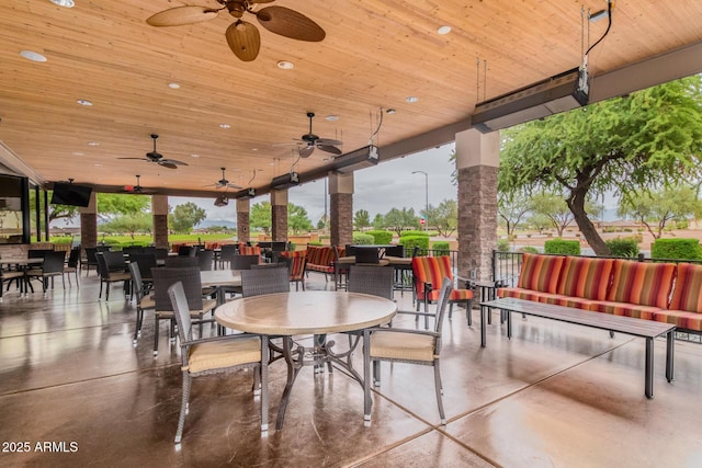 view of patio featuring ceiling fan and outdoor dining space