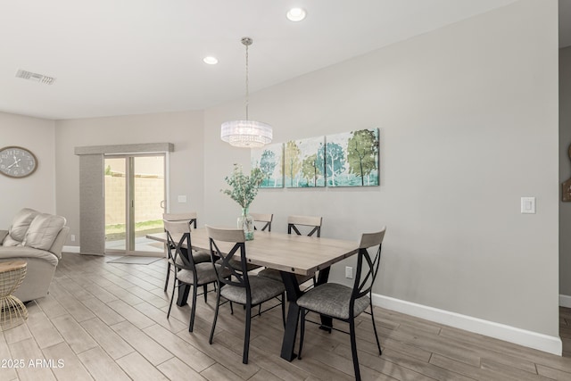 dining room with wood finish floors, recessed lighting, visible vents, and baseboards