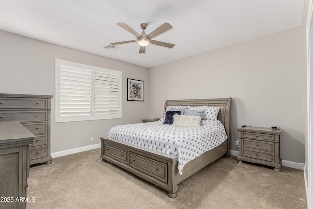 bedroom featuring baseboards, visible vents, and light colored carpet