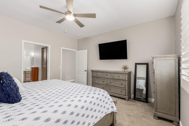 bedroom with light colored carpet, visible vents, connected bathroom, ceiling fan, and baseboards