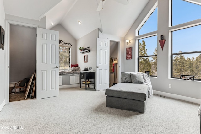 living area with ceiling fan, high vaulted ceiling, and carpet