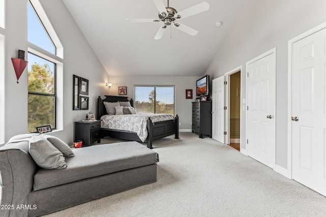 carpeted bedroom with high vaulted ceiling and ceiling fan