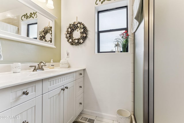 bathroom with vanity and tile patterned floors