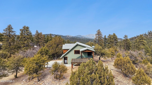 rear view of house with a mountain view