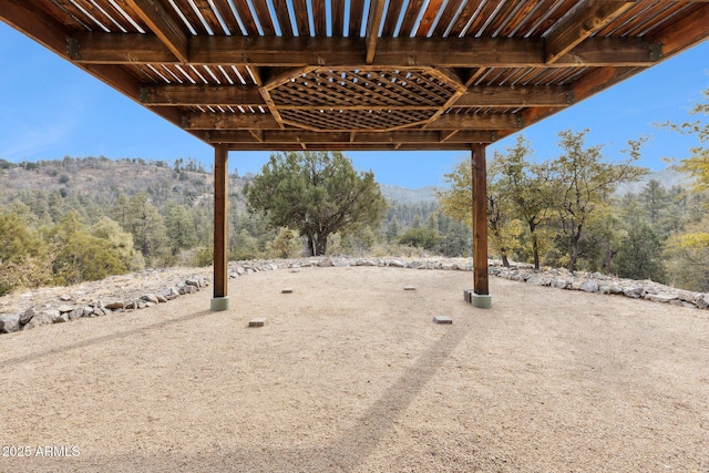 view of yard featuring a mountain view and a patio area