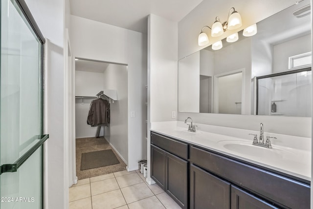 bathroom with vanity, tile patterned floors, and an enclosed shower