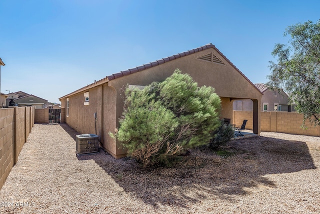 view of side of property with cooling unit