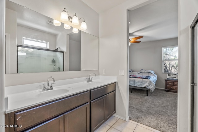 bathroom featuring vanity, tile patterned floors, ceiling fan, and an enclosed shower