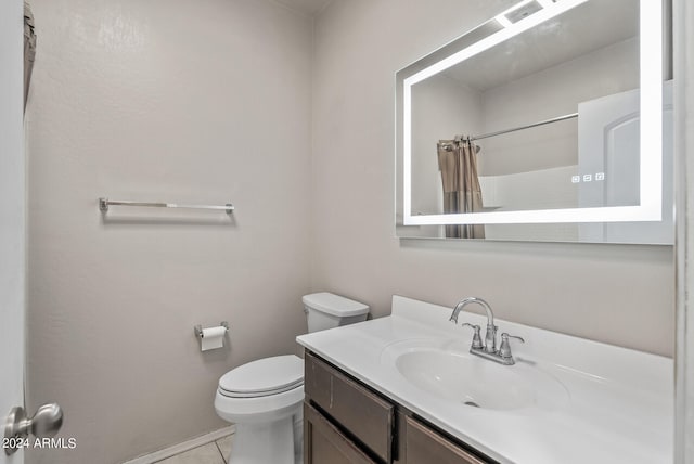 bathroom with a shower with shower curtain, vanity, toilet, and tile patterned floors