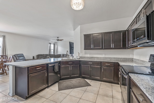 kitchen featuring appliances with stainless steel finishes, kitchen peninsula, light tile patterned floors, ceiling fan, and sink