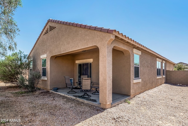 back of house featuring a patio