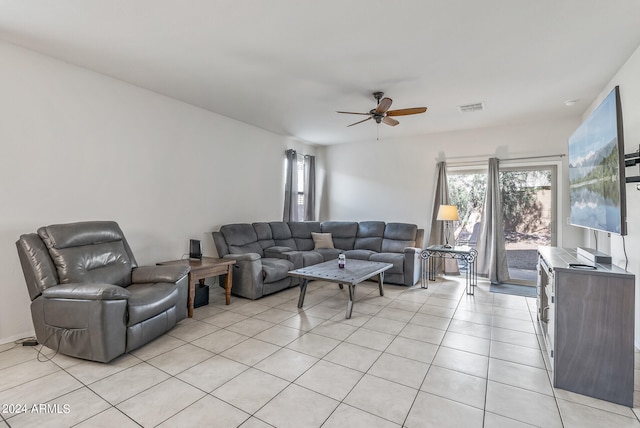 tiled living room with ceiling fan