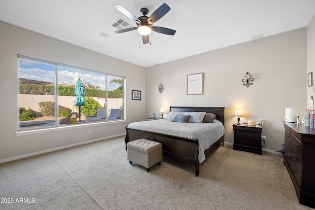 bedroom featuring visible vents, carpet floors, baseboards, and ceiling fan