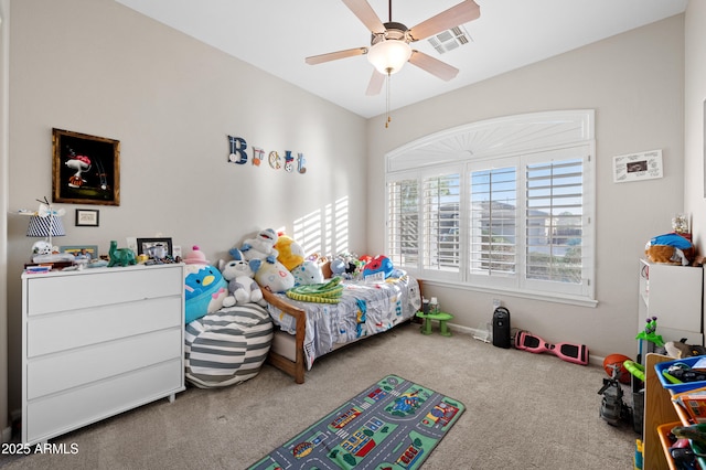 carpeted bedroom with visible vents and a ceiling fan