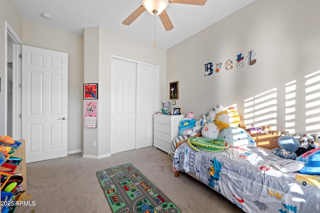 bedroom with a closet, baseboards, ceiling fan, and carpet floors