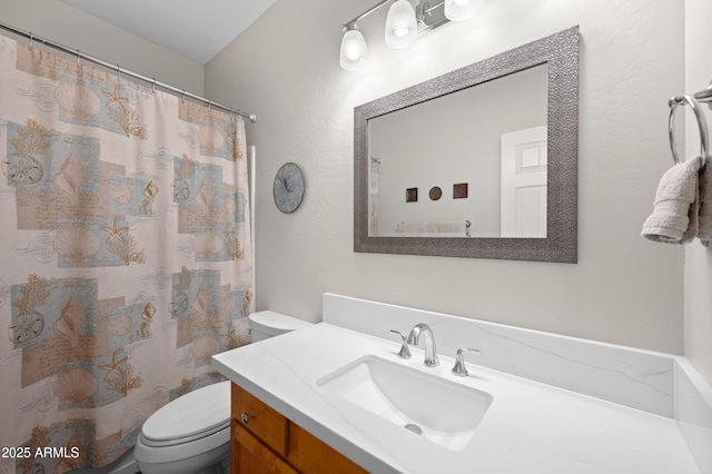 full bathroom with vanity, toilet, and a shower with curtain