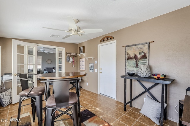 dining space with ceiling fan