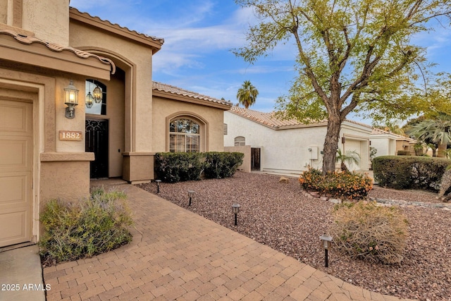 view of front of home with a garage