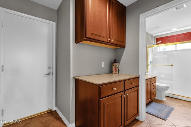 kitchen with light tile patterned floors