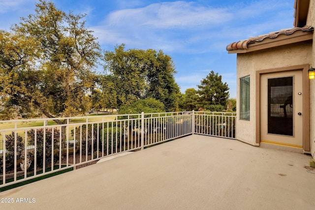 view of patio featuring a balcony