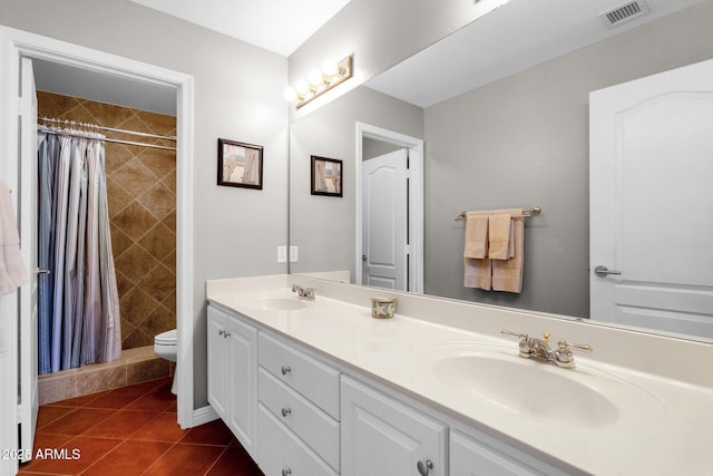 bathroom featuring tile patterned floors, walk in shower, toilet, and vanity