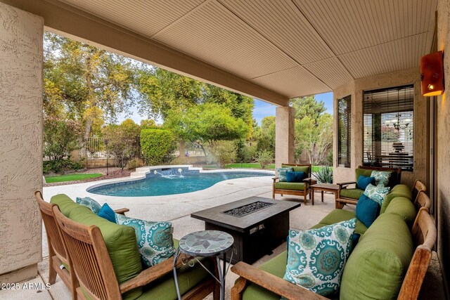 view of pool featuring an outdoor living space with a fire pit and a patio