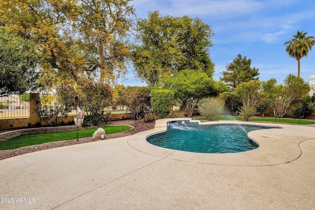 view of pool with a lawn, pool water feature, and a patio