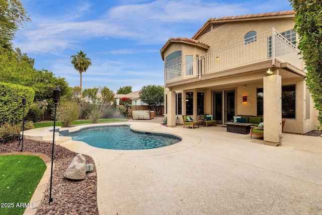 view of pool featuring an outdoor living space and a patio