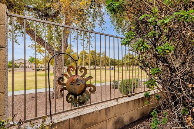 view of gate featuring a yard