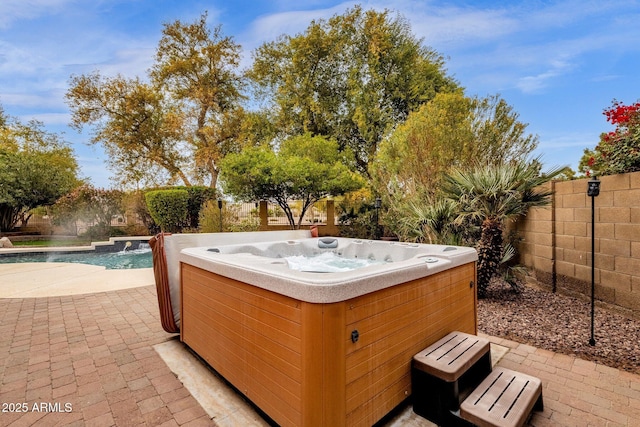 view of patio featuring a hot tub