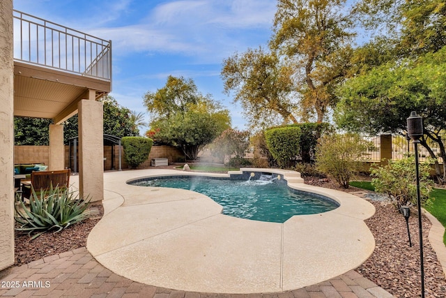 view of pool featuring pool water feature and a patio